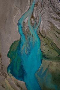 Turquoise river delta from above